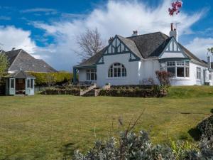 a large white house with a yard at 3 Bed in Gullane oc-96141 in Gullane