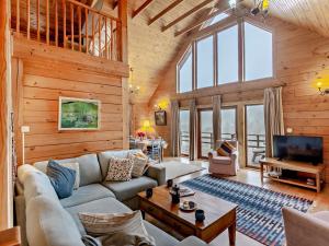 a living room with a couch and a tv at 3 Bed in Fort William oc-95783 in Torlundy