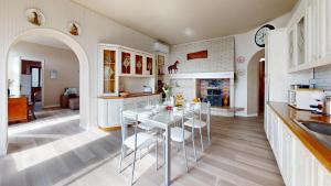 a kitchen with a table and chairs in a room at Apt Giada Salò magic view in Salò