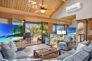 an open living room with a view of the ocean at Kahana Village 9 · KHV 9 2BR Oceanfront Condo w Panoramic Maui in Lahaina