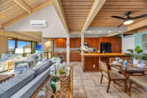 a living room with a couch and a table at Kahana Village 9 · KHV 9 2BR Oceanfront Condo w Panoramic Maui in Lahaina