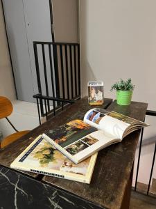 a book sitting on top of a table at Roomah Ipoh En-suite attached-Bath R2 in Ipoh +25 photos