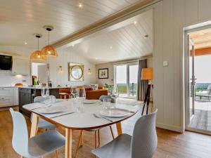 a kitchen and dining room with a table and chairs at 2 Bed in Anstruther oc-83174 in Anstruther