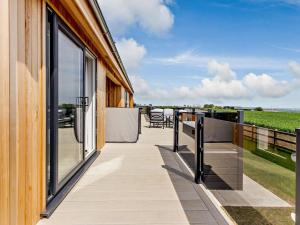 a balcony with a view of the ocean at 2 Bed in Anstruther oc-83174 in Anstruther