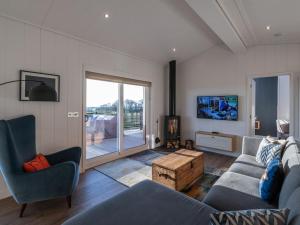 a living room with a couch and a table at 2 Bed in Anstruther oc-72436 in Anstruther