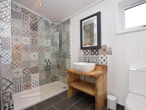 a bathroom with a sink and a shower at 2 Bed in Anstruther oc-72436 in Anstruther +16 photos