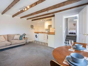 a living room with a couch and a table at 1 Bed in Biggar oc-82923 in Biggar