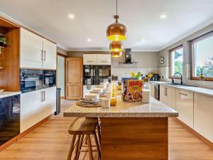 a kitchen with a island with a counter top at 6 Bed in Perth oc-96289 in Stanley