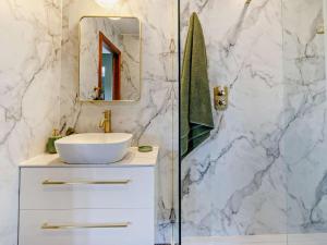 a bathroom with a white sink and a mirror at 6 Bed in Perth oc-96289 in Stanley +52 photos