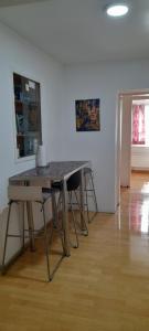 a table and chairs in a room with a table at Ela Gar 1 WG Zimmer Wohngemeinschaft in Garsten