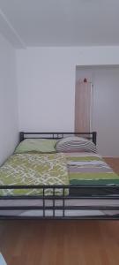 a bed in a room with a bed frame at Ela Gar 1 WG Zimmer Wohngemeinschaft in Garsten +4 photos