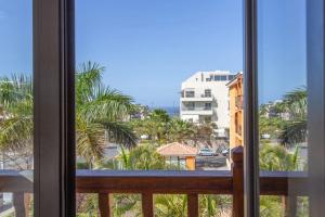 a view of the beach from a room with a window at Ojos del Océano in Palm-Mar