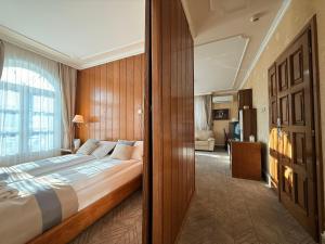 a bedroom with a large bed in a room at Garni Hotel Lav in Belgrade
