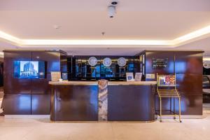 a bar in a hotel lobby with a counter and refrigerator at Al Muhaidb Residence Al Malaz 3 - Economic in Riyadh