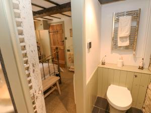 a bathroom with a toilet and a sink at In & Out Cottage in Leyburn +31 photos