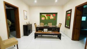 a dining room with a table and a chair at Williston Bly of Gly in Williston