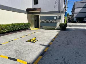 a parking lot in front of a building at Tiffany's Place in Imus