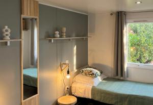 a small room with a bed and a window at Vista Mare , Cap corse in Meria +67 photos
