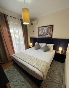 a bedroom with a large bed in a room at Hotel Ibiza in Golem
