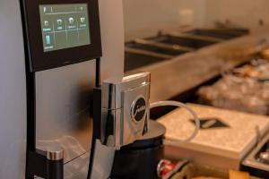 a close up of a coffee maker in a kitchen at Hotel Atlanta in Valkenburg