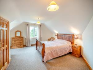 a bedroom with a bed and a dresser and a window at 5 Bed in Mountcharles oc-ii11344 in Mountcharles