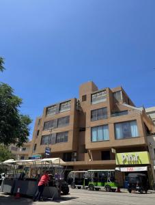 a person is standing in front of a building at Batroun Staycation in Batroûn +40 photos