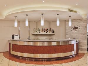 a lobby with a bar in a hotel at Hotel Planet International in Arezzo