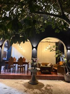 a living room with a table and a couch at Astra Tourist Inn near Airport with high speed free Wifi in Puerto Princesa City