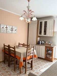 a dining room with a table and some chairs at La Casa del Sole in Corleone