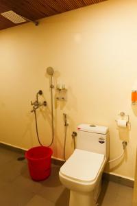 a bathroom with a toilet and a shower at Agonda Junction in Agonda