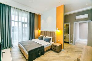 a bedroom with a bed and a large window at Lanai Villas Beach Side in Baku +32 photos