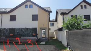 a house with red writing on the side of it at MRȘ House 1 in Bucharest