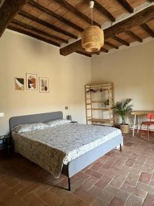 a bedroom with a large bed in a room at La Casa di Oli in Amelia