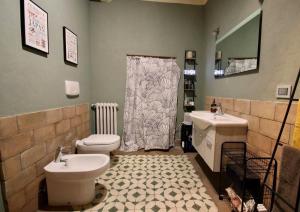 a bathroom with a shower and a toilet and a sink at La Casa di Oli in Amelia