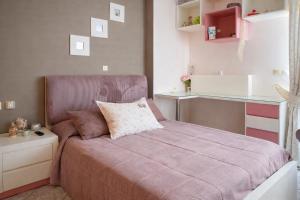 a small bedroom with a bed and a counter at Villa Elysian Private pool & garden view in Antimácheia +17 photos