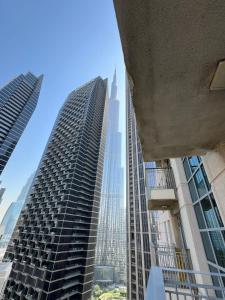 a view of two tall buildings in a city at Romantic hideaway with Burj view in Dubai