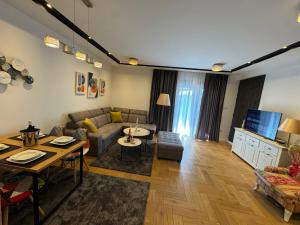 a living room with a couch and a table at ToP-HILL in Trebinje