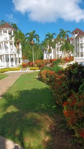 a row of houses and flowers in a park at Mar Paraiso in Ocho Rios