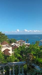 a view of the ocean from the balcony of a house at Mar Paraiso in Ocho Rios +2 photos