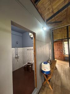 a bathroom with a shower and a toilet in a room at Verde Guest House in Shillong
