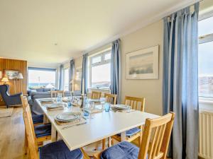 a dining room with a table and chairs at 4 Bed in Scourie oc-ca399 in Scourie +20 photos