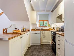 a kitchen with white cabinets and a counter top at 1 Bed in Elgin oc-94281 in Elgin +22 photos
