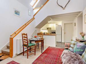 a living room with a table and a kitchen at 1 Bed in Elgin oc-94281 in Elgin