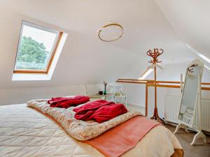a bedroom with a bed with red sheets and a window at 1 Bed in Elgin oc-94281 in Elgin