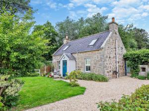 an old stone house with a blue door at 1 Bed in Elgin oc-94281 in Elgin