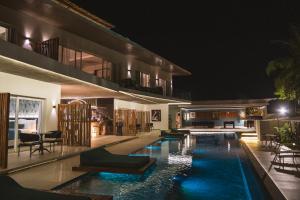 a house with a swimming pool at night at The View Pipa in Pipa +33 photos