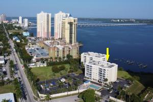an aerial view of a city with buildings and the water at Palm Beach Landings A107 in Fort Myers