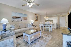 a living room with a couch and a table at Estero Island Beach Villas 105 in Fort Myers Beach