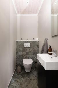 a bathroom with a white toilet and a sink at Orrmötesvägen 21 - Funäsdalen in Funäsdalen