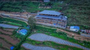 an aerial view of a building with solar panels at Matha homestay Vattavada in Vattavada